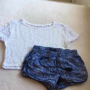 White top and blue shorts